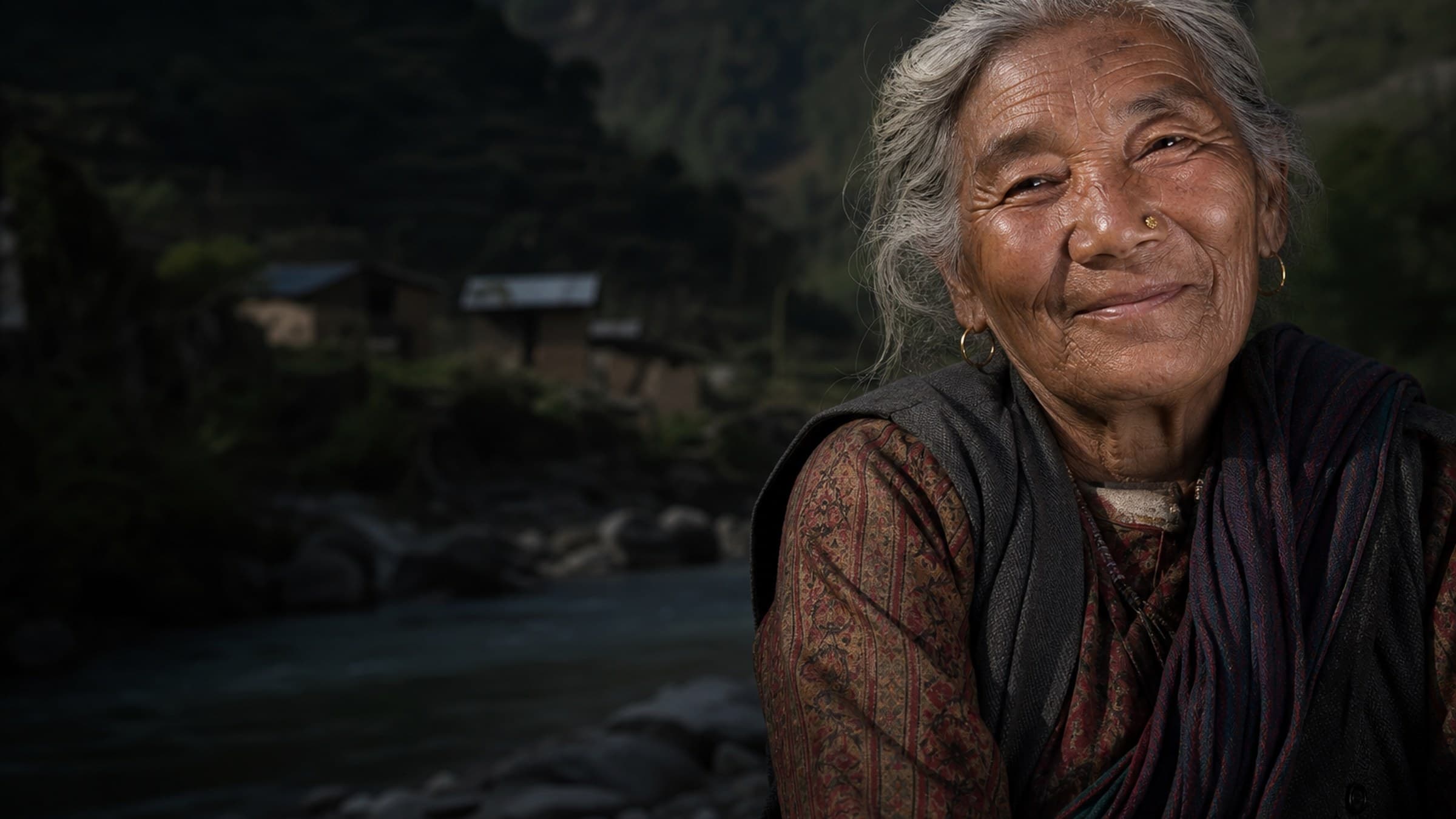 Elderly Majhi community mother from the Bodgaun locality, smiling